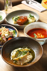 dim sum in plate close up. chinese traditional dim sum in plate with microgreen. dinner table concept