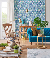 Blue classic sofa furniture home design and wood rocking chair, gold lamp and middle table, palette bookshelf, vase of green plant and home accessory style,interior decor.