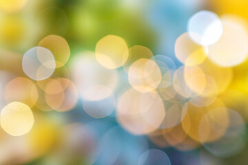 Colored defocused background with glowing bokeh. Summer background.