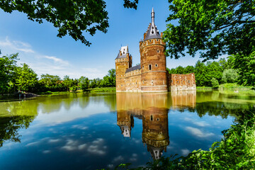 Charming Beersel Castle. The walls and towers of a medieval castle. The castle and the reflection in the moat. Beersel Flanders, Belgium