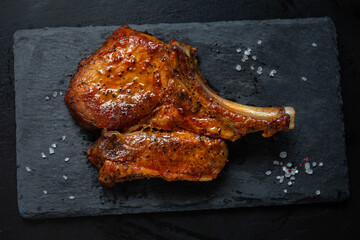 Grilled piece of pork with bone