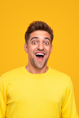 Amazed man looking at camera