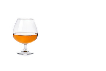 Cognac or whiskey drink isolated on white background. Copy space
