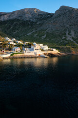 Fototapeta na wymiar Kamares town with traditional white houses on Sifnos island on sunset. Greece