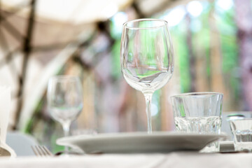 Wedding. Banquet. Table for guests, are served with cutlery and crockery and covered with a tablecloth.