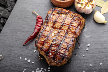 Fresh delicious juicy steak with vegetables and spices