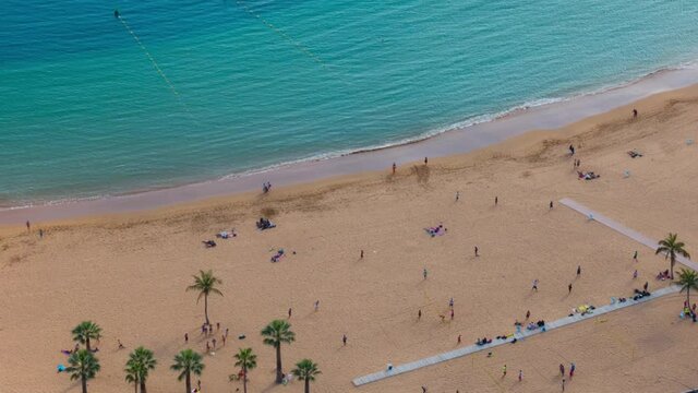 Aerial timelapse of people on Teresitas beach, Tenerife, Canary island