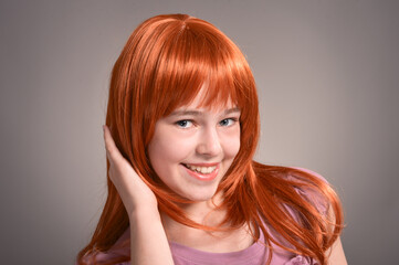 Close up portrait of cute girl with red hair posing