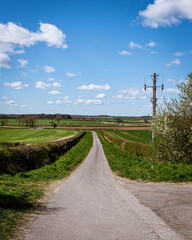 Fototapeta na wymiar UK road through the fields