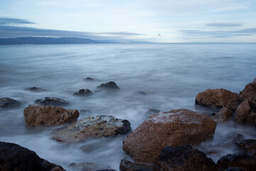 calm sea with stones with nd filter