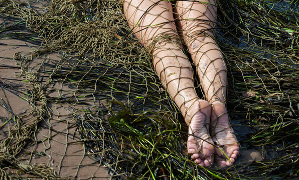 nude woman and fishing net