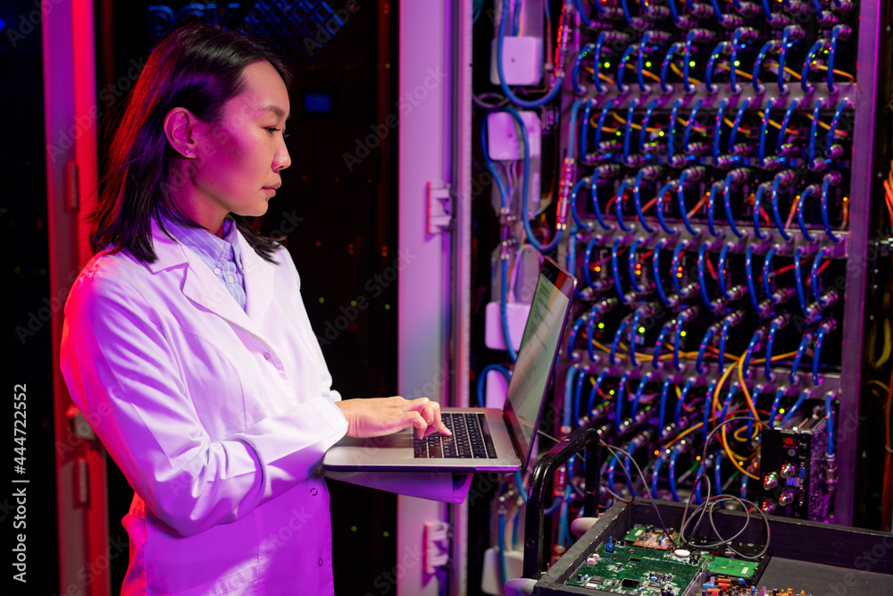 Poster busy asian network engineer analyzing data