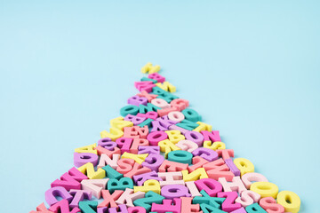 Many multicolored letters in shape of road. Reading, studying at school.