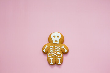 Skeleton gingerbread cookie pink background Halloween