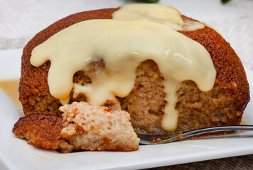 traditional South African Malva pudding served with custard