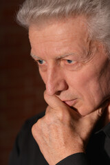 Close up portrait of thoughtful senior man