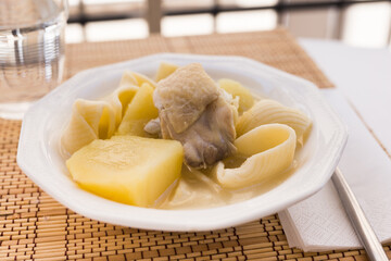 chicken broth soup with chicken, potatoes, and pasta shells