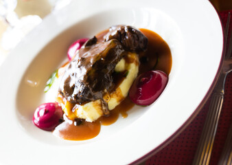 beef cheek with mashed potatoes and currant oil