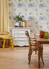 Modern wallpaper background cabinet table and wooden chair style, vase of plant and yellow curtain interior decor.