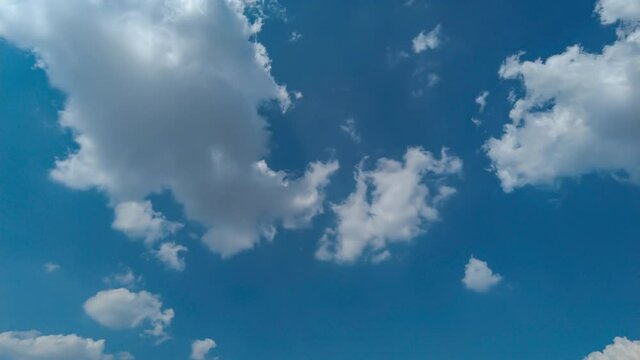 White Cumulus Clouds Appear And Disappear In The Sky On A Sunny Summer Day. Timelapse