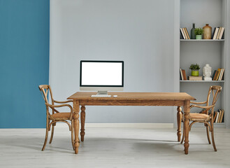 Decorative wooden furniture office room with computer and laptop style, retro cabinet and shelf background, blue and grey wall interior concept.
