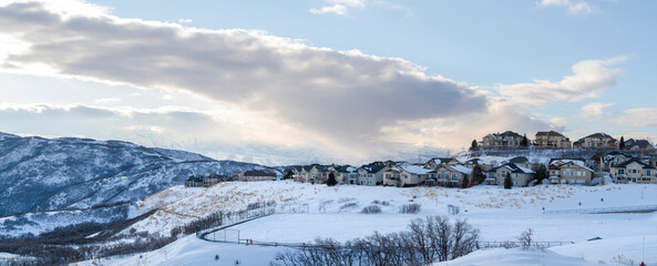 Residential area on top of a snowy mountain with large houses