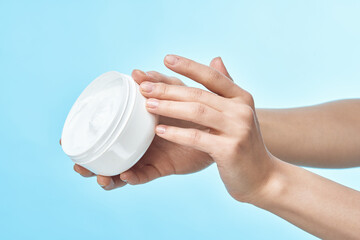 female hand cream jar cosmetics spa treatments dermatology