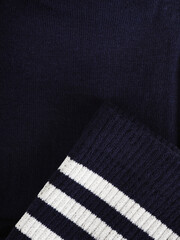 the edge of multi-colored socks, curved sleeves, several layers of fabric