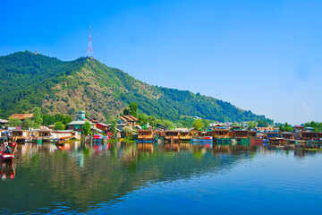 A variety of colorful boathouses. Beautiful lake and mountain views. View of Dal Lake in Srinagar,...
