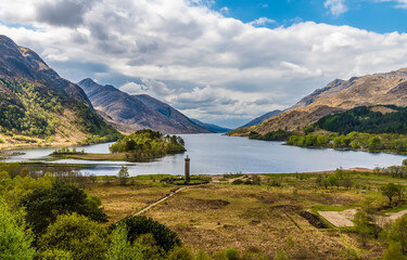 A view over the shoreline down the length of Loch Shiel, Scotland on a summers day