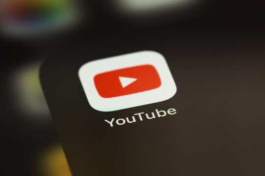 YouTube mobile icon app on screen smartphone iPhone closeup. YouTube is a free video sharing application that anyone can watch. Moscow, Russia - June 14, 2021