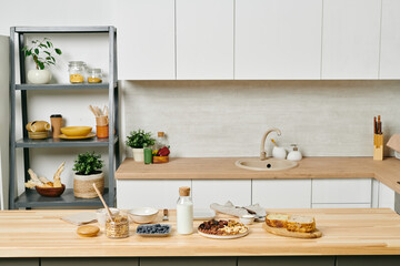 Some organic food for making breakfast on wooden kitchen table