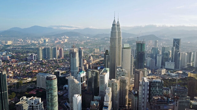 Aerial view of Kuala Lumpur cityscape. Photo from a drone of Asian skyscrapers. All logos are blurred. © skymediapro