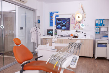 Empty medical clinic orthodontic hospital room with stomatology dental equipment, ready for...