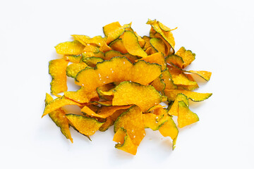 Green pumpkin slice chips on white background.