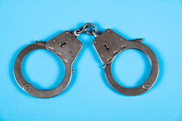 Handcuffs on the Blue Paper