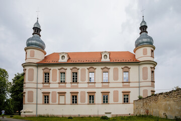 Krasne Brezno, Bohemia, Czech Republic, 26 June 2021:  Baroque castle with towers and green lawn, National cultural monument family chateau in summer sunny day