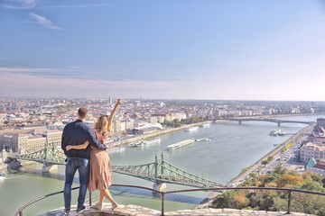 lovers couple budapest walk, spring landscape view capital of hungary, man and woman tourists