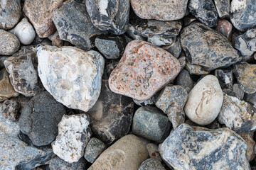 top view of pebbles or stones on beach, full-frame nature background