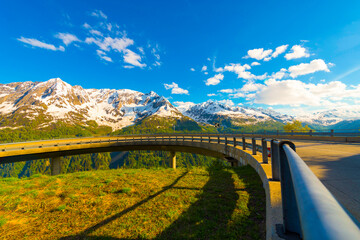 Elevated Mountain Road with Railing and With Mountain View in a Sunny Day in Ticino, Switzerland.
