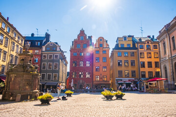 Stockholm Sweden - July 1 2021: Colourful historic buildings and houses in Gamla Stan, Main S. Romantic medieval city centre alleys. Popular tourist destination in Scandinavia on a sunny day.