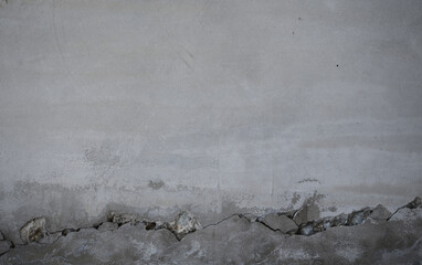Cracked concrete and cement texture. Gray mortar plasterer wall background. Wall façade as if it...