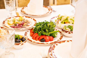 serving a large banquet table in a restaurant or at home for a holiday.