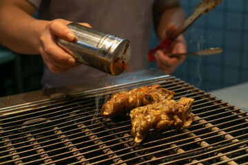 Delicious roast pig's feet. The chef is baking pig's feet