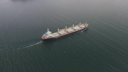 Drone view of the dry cargo ship in motion