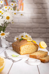 Lemon cake decorated with chamomile