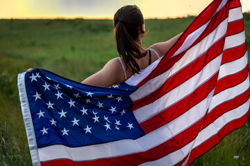 Close-up of a girl wrapped in the flag of america.