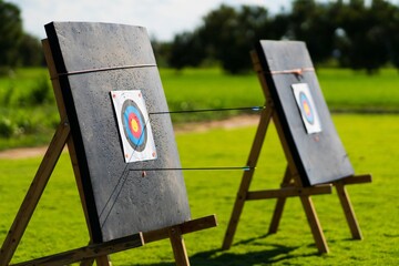 Colored target board with arrows archery target background