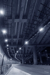 Fototapeta na wymiar Empty tunnel in the dark. Transportation background