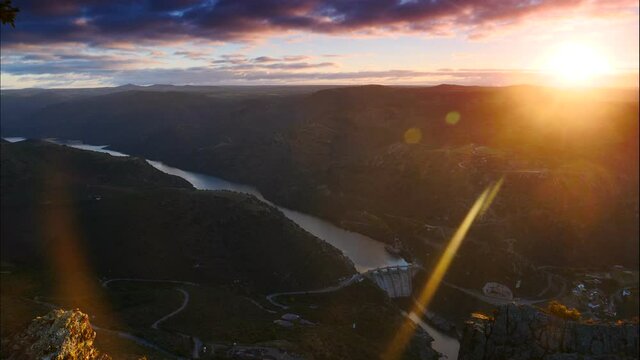 Time lapse of daybreak over Douro river and spanish Saucelle Dam. Border between Portugal and Spain. National Parks. View from Penedo Durao lookout.